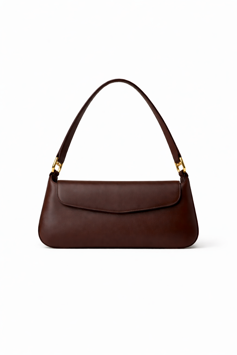 Brown handbag with gold hardware on a white background