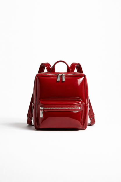 Cherry red boxy leather backpack studio product photo on white background